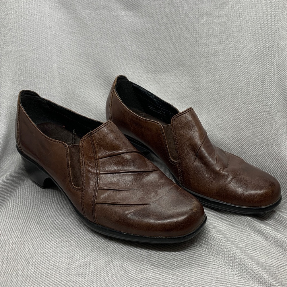 Clarks slip-ons in brown leather.